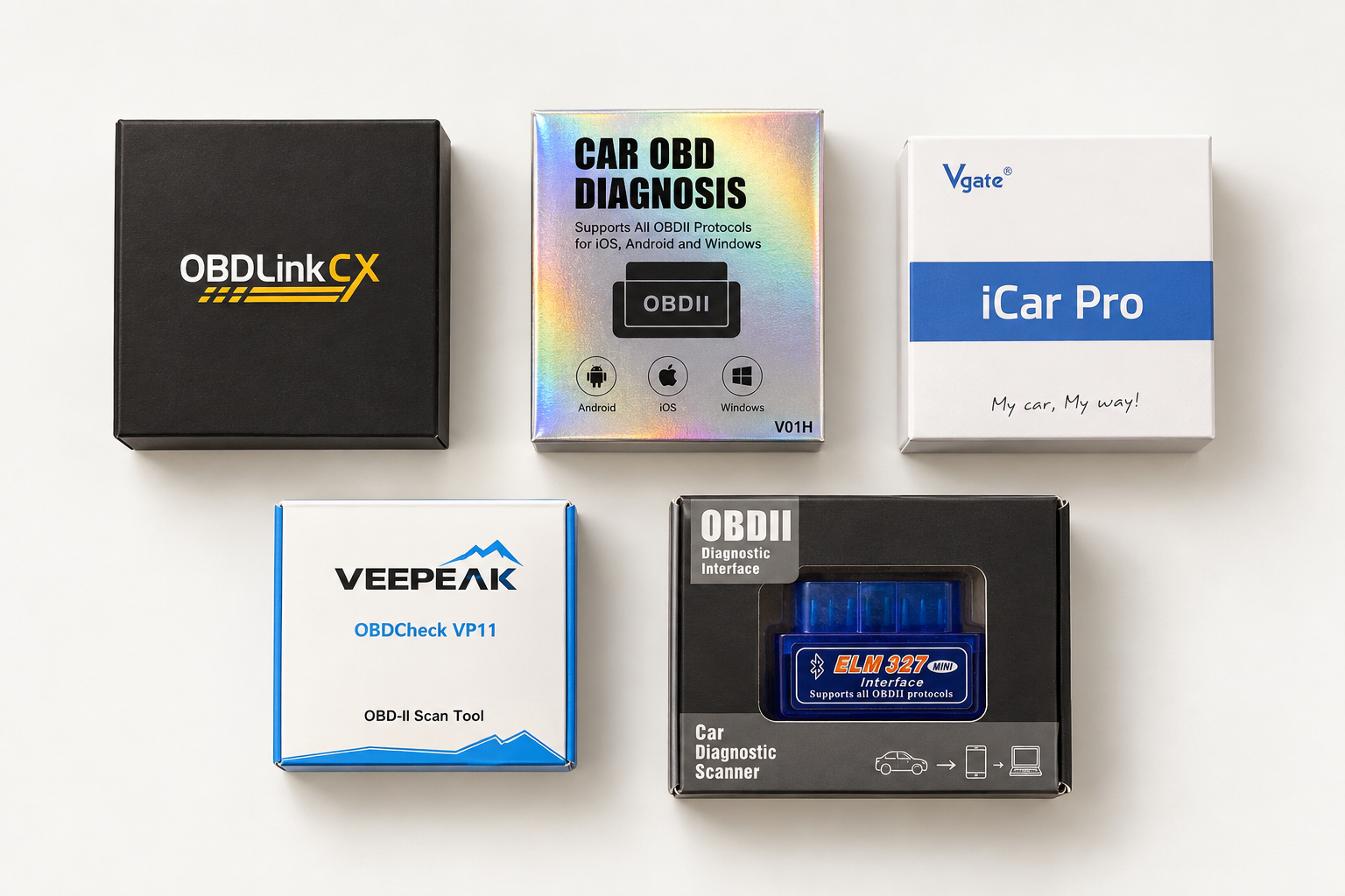 Five boxed OBD adapters from the Scout workbench, including OBDLink CX, Veepeak, Vgate iCar Pro, and a blue ELM327-style adapter.
